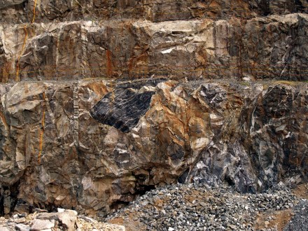 chromite large clast Figure 19 - Igneous breccia containing chromite clasts (Boula, Orissa, India).